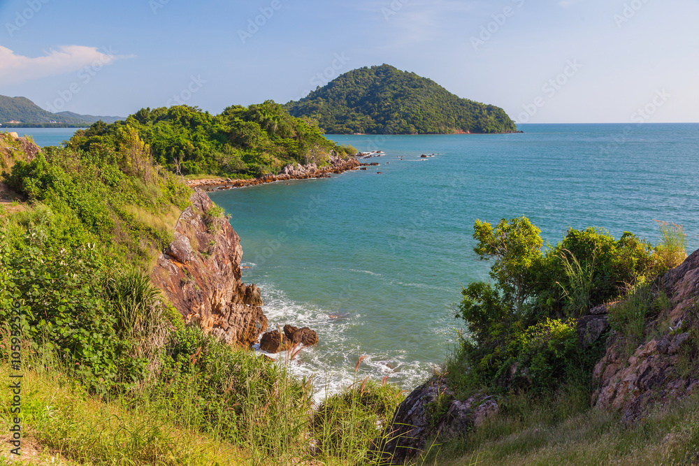 Fototapeta premium Beautiful seascape with small mountain, on blue sky background