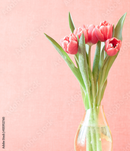bouquet of tulips in vase, pastel colours, space for text