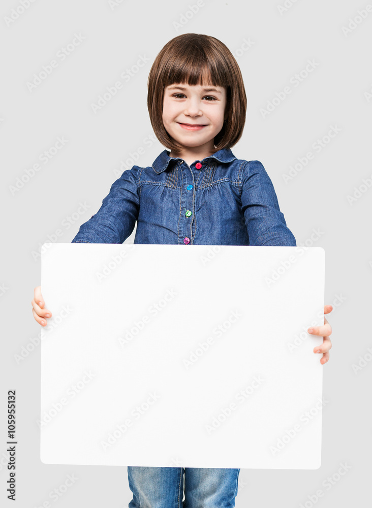 Happy little girl holding a white banner Happy little girl holding a white banner