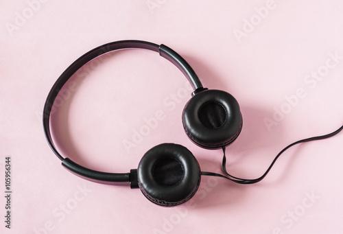 Headphones on pink paper color