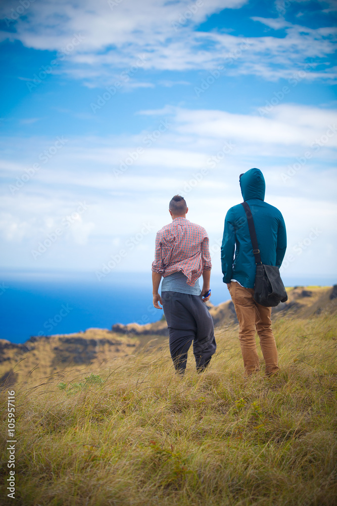 two men on the edge of the Rano Kau volcano two men on the edge of the Rano Kau volcano