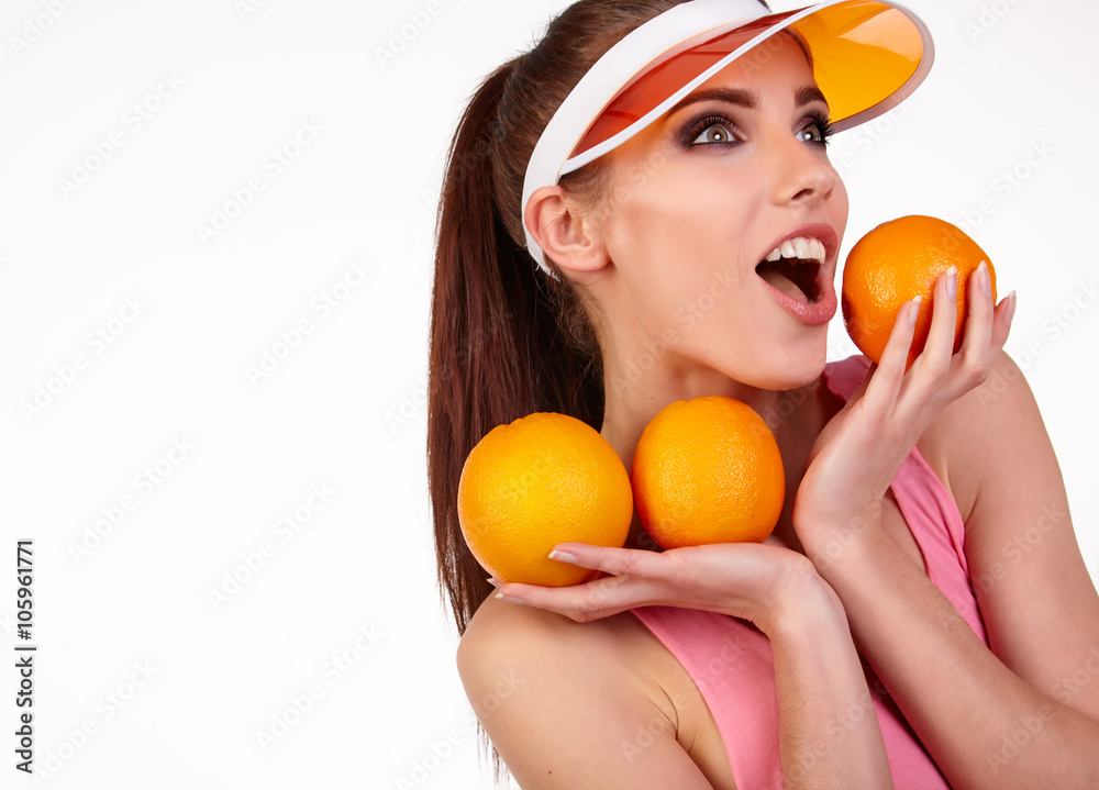 Beautiful close-up young woman with oranges. Healthy food concep Beautiful close-up young woman with oranges. Healthy food concep