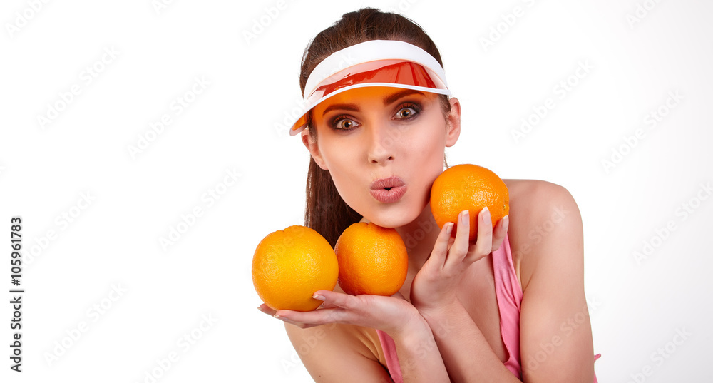 Beautiful close-up young woman with oranges. Healthy food concep