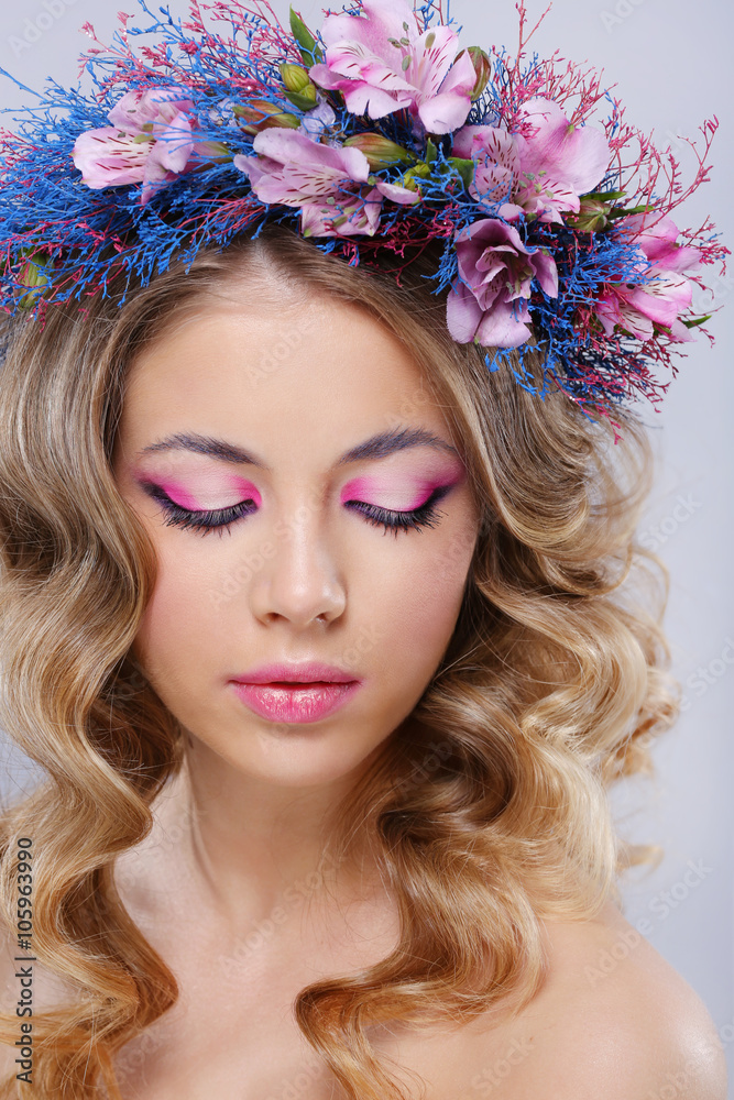 Beautiful young woman in wreath