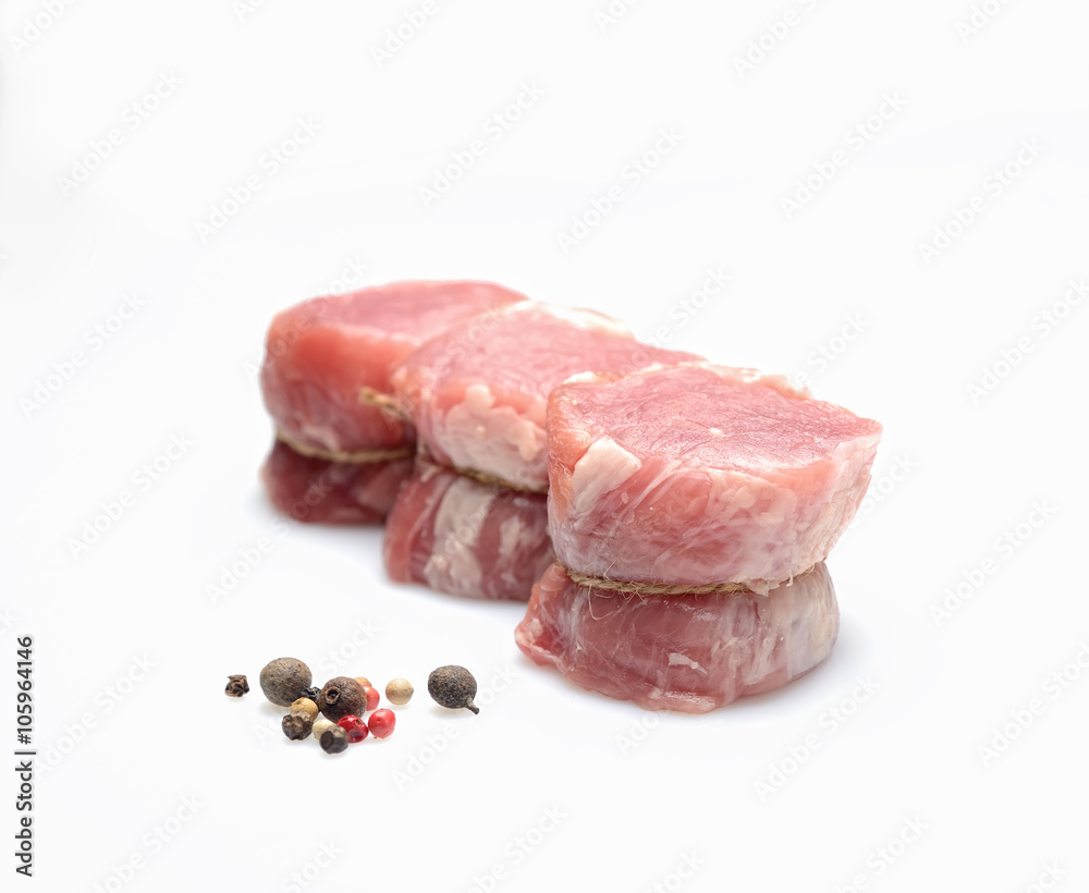 raw fillet medallions on a white background