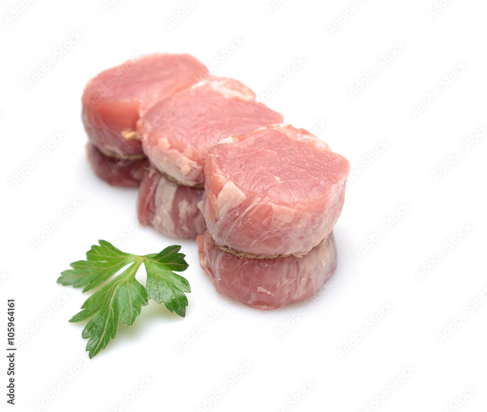 raw fillet medallions on a white background raw fillet medallions on a white background