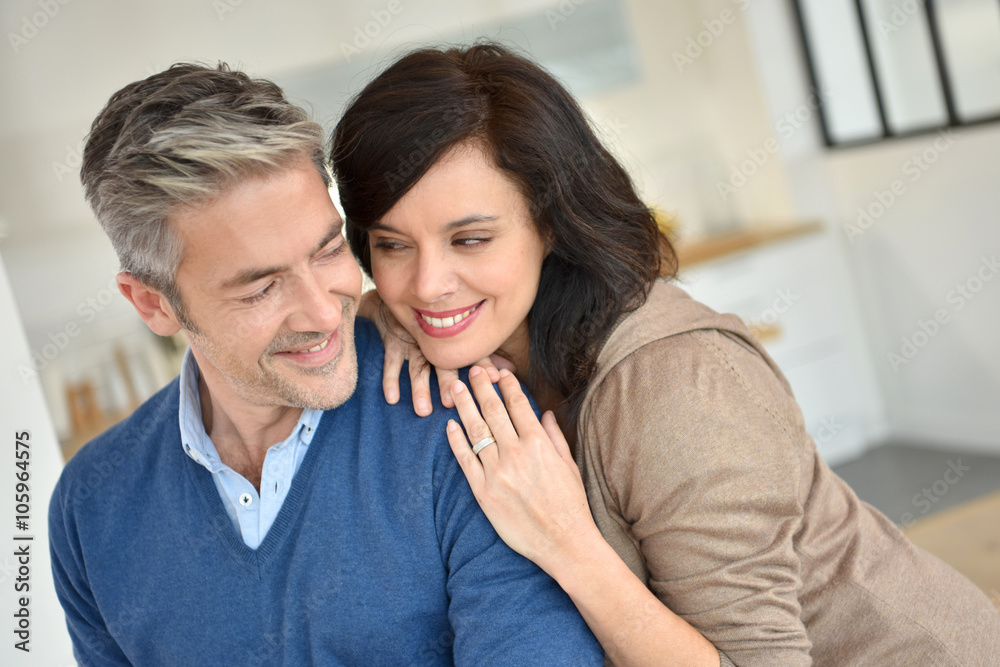 Middle-aged couple embracing each other Middle-aged couple embracing each other