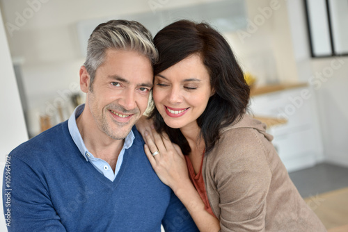 Middle-aged couple embracing each other