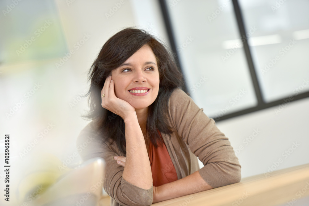 Portrait of smiling dark-haired woman