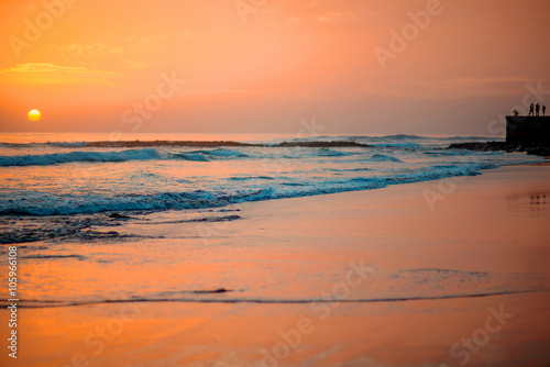 Beach with glossy surface reflecting beautiful seascape on the sunset in Maspalomas on Gran Canaria island © rh2010