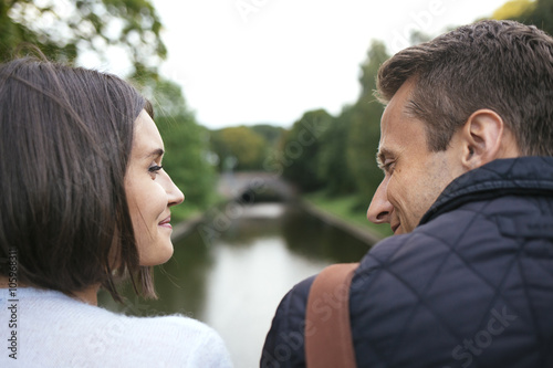 Young couple faces sloseup looking and smiling