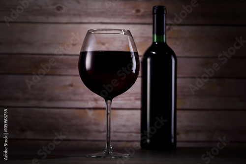 Glass and bottle of red wine