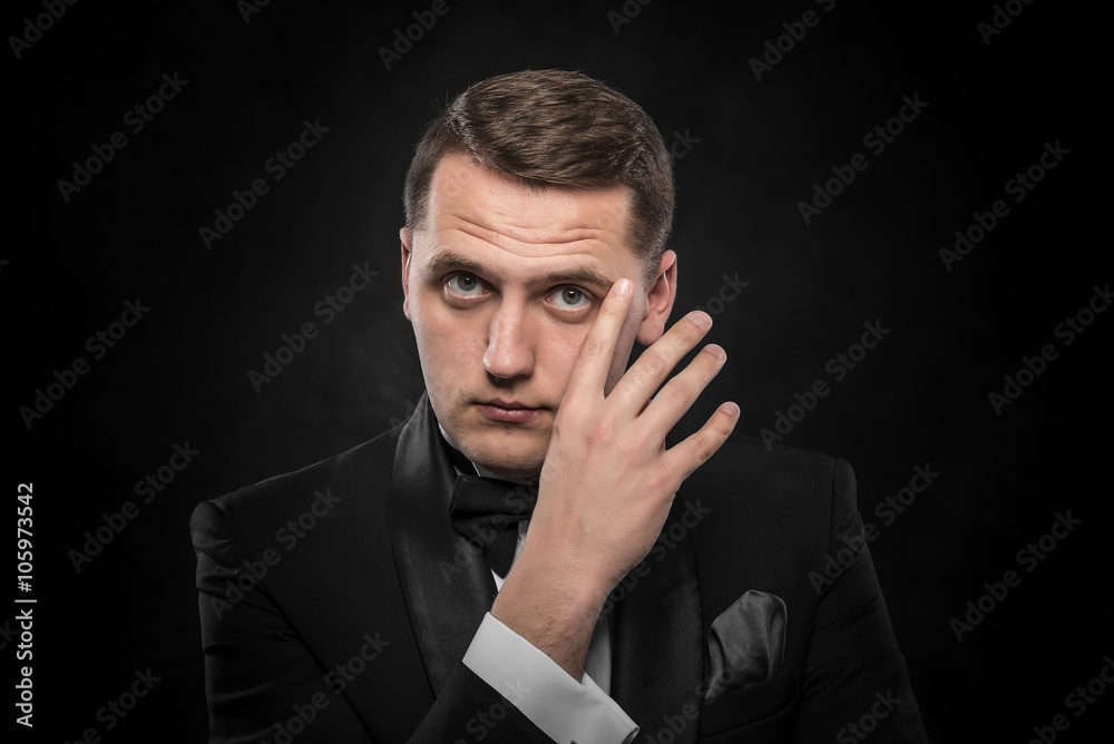 Young handsome man in black suit. Young handsome man in black suit.