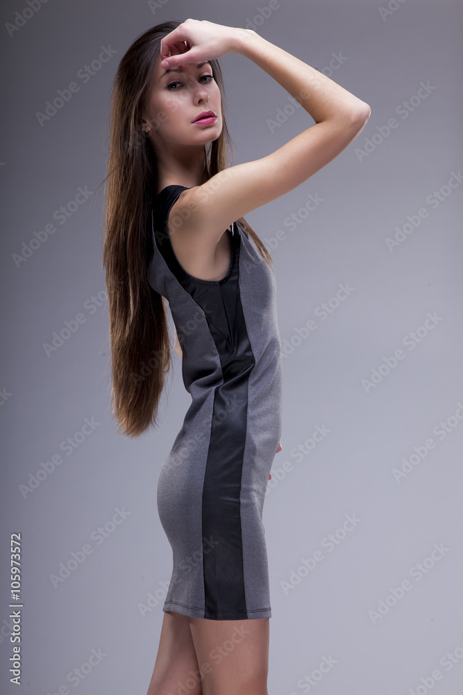 Young slim sexy woman in fashionable dress isolated on white bac Young slim sexy woman in fashionable dress isolated on white bac