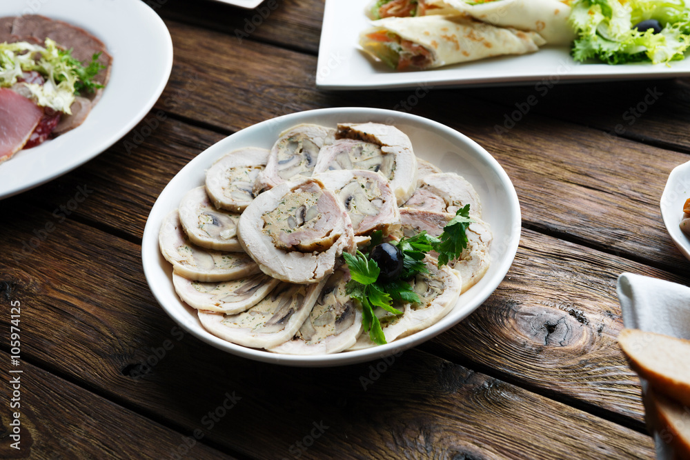 Restaurant food. Sliced white meat roulade Restaurant food. Sliced white meat roulade