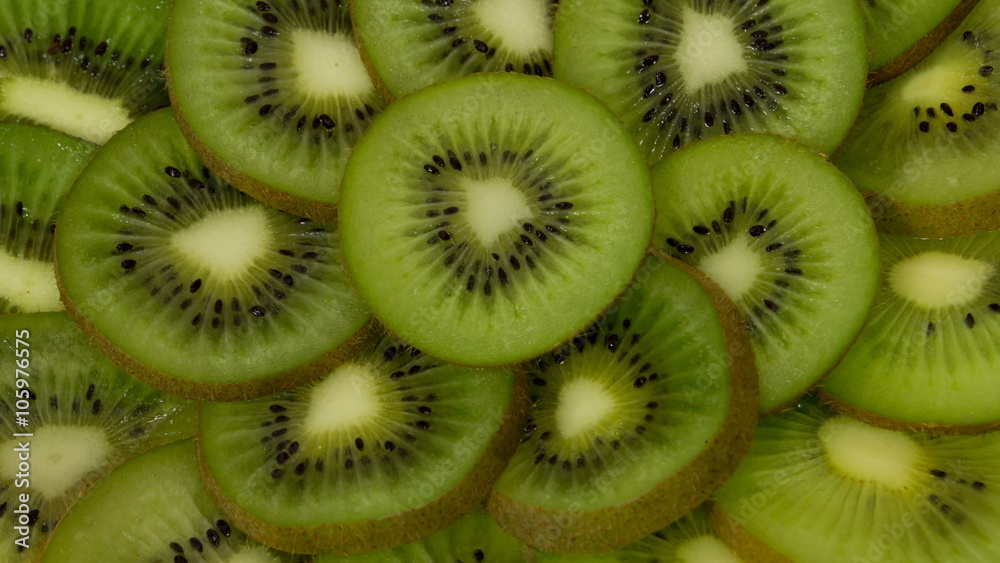 Fresh Kiwi Slices Close-up Rotating. Seamless Looping Motion. Fresh Kiwi Slices Close-up Rotating. Seamless Looping Motion.