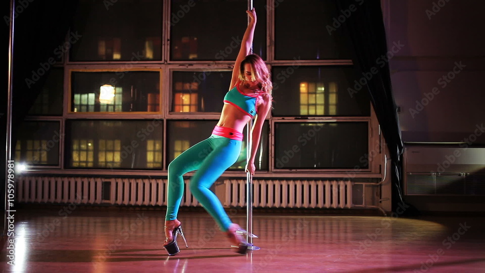 Young sexy woman pole dance
