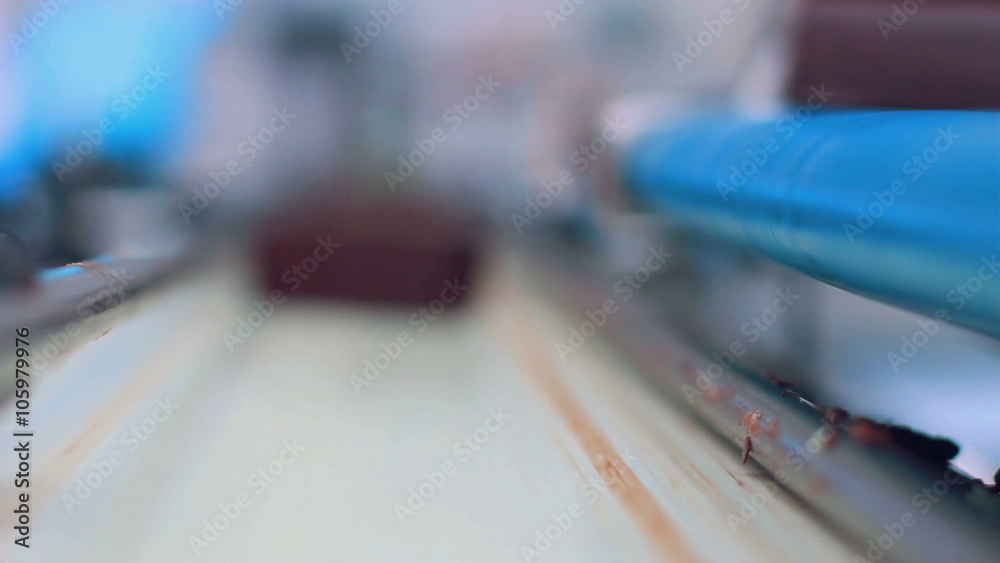Chocolate candy falls onto a conveyor belt of packaging line/Dessert on manufacturing line at food processing plant/Food on production line at factory/Food industry/Confectionery on conveyor Chocolate candy falls onto a conveyor belt of packaging line/Dessert on manufacturing line at food processing plant/Food on production line at factory/Food industry/Confectionery on conveyor