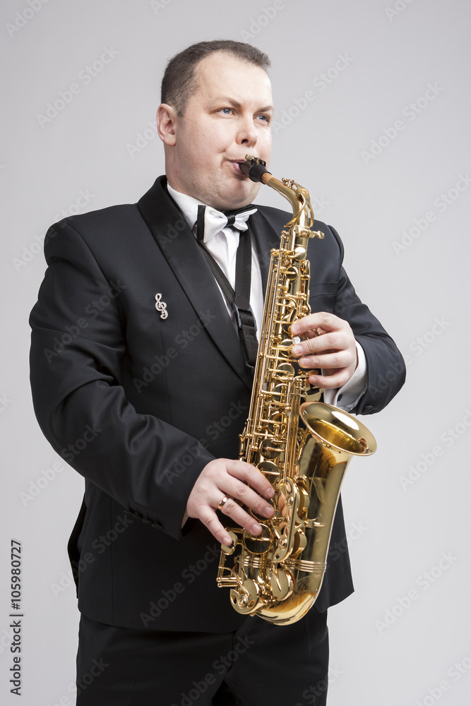 Fototapeta premium Music Concept and Ideas. Portrait of Caucasian Player in Suit