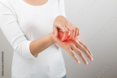 Women scratch the itch with hand, on white background