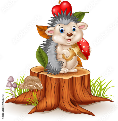 Little hedgehog holding mushroom on tree stump 