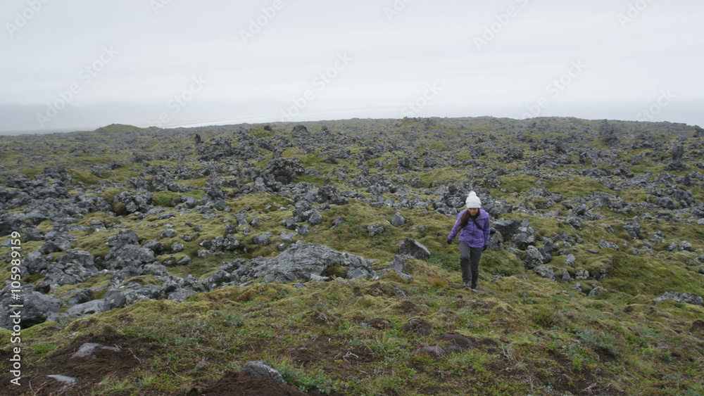 Woman photographer and hiker on hike with SLR camera outdoors. Female hiking taking pictures outside living outdoor lifestyle in nature landscape on Snaefellsnes, West Iceland. RED EPIC SLOW MOTION. Woman photographer and hiker on hike with SLR camera outdoors. Female hiking taking pictures outside living outdoor lifestyle in nature landscape on Snaefellsnes, West Iceland. RED EPIC SLOW MOTION.