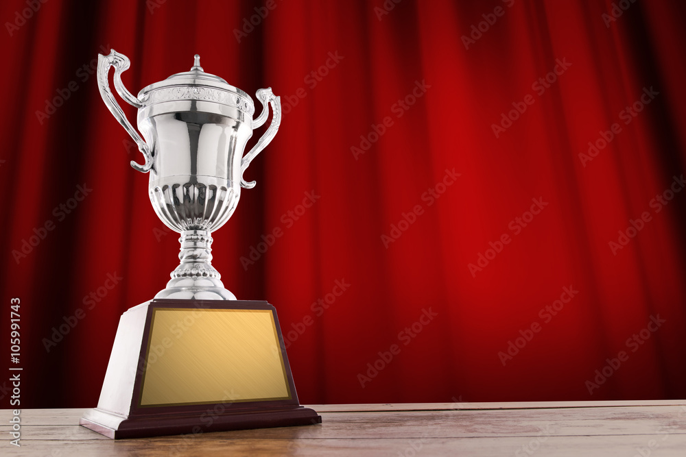 champion silver trophy on wood table with Red closed curtain bac Stock  Photo | Adobe Stock