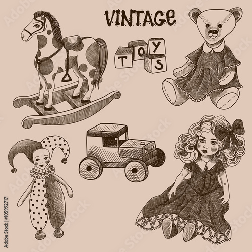 Set of vintage toys. Doll, cubes, jester, teddy bear, wooden car, rocking horse