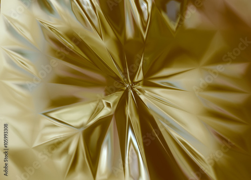 Metal gold copper silver bent crushed dented distorted abstract reflective background.