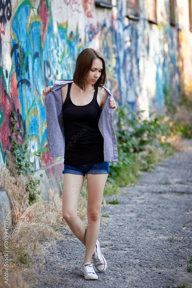Young girl on graffiti background