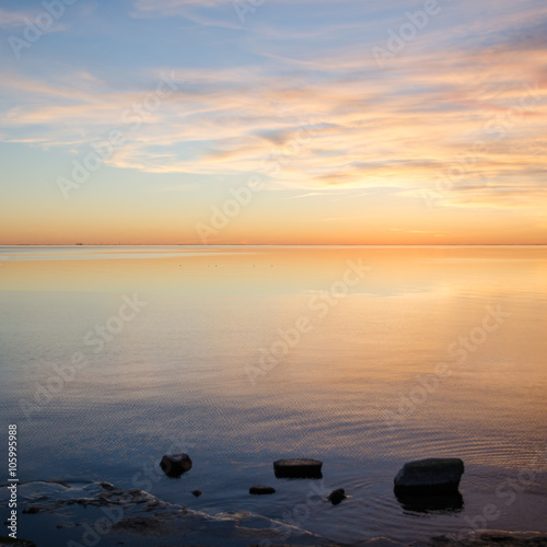 Bright sunset view with calm water