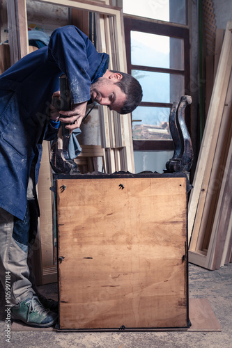 Carpenter restoring Wooden Furniture