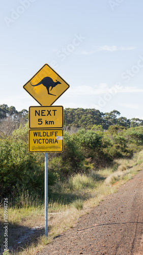 yellow road sign with a kangaroo