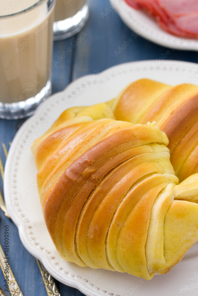 croissant with ham on plate and glasses of coffee with milk croissant with ham on plate and glasses of coffee with milk