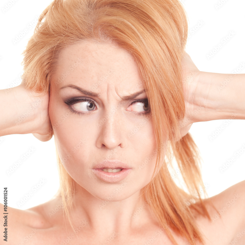 Closeup portrait of young girl 20-25 year old close her ears by hands. Blonde woman posing over white. Looking away. Isolated. Closeup portrait of young girl 20-25 year old close her ears by hands. Blonde woman posing over white. Looking away. Isolated.