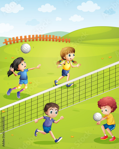 Boys and girls playing volleyball in the park