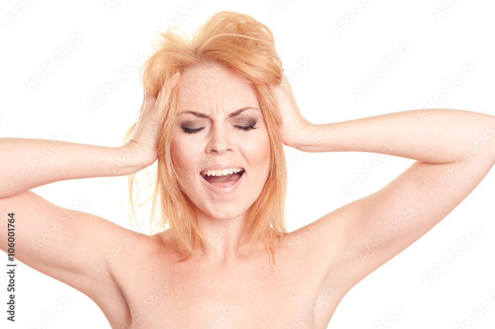 Closeup portrait of blonde young girl 20-25 year old shouting, pressing head over white. Caucasian woman posing in studio. Isolated