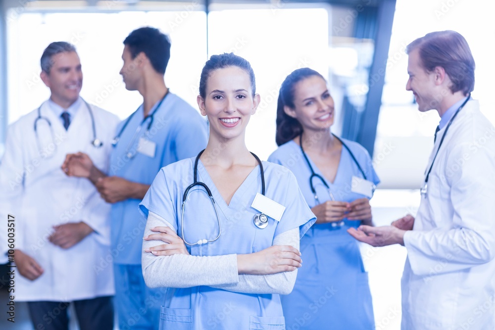 Female doctor standing in front and smiling at camera Female doctor standing in front and smiling at camera