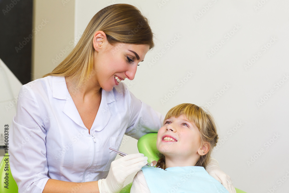 A young girl getting her dental checkup at the dentist A young girl getting her dental checkup at the dentist