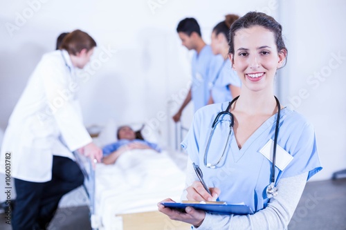 Portrait of female doctor holding clipboard
