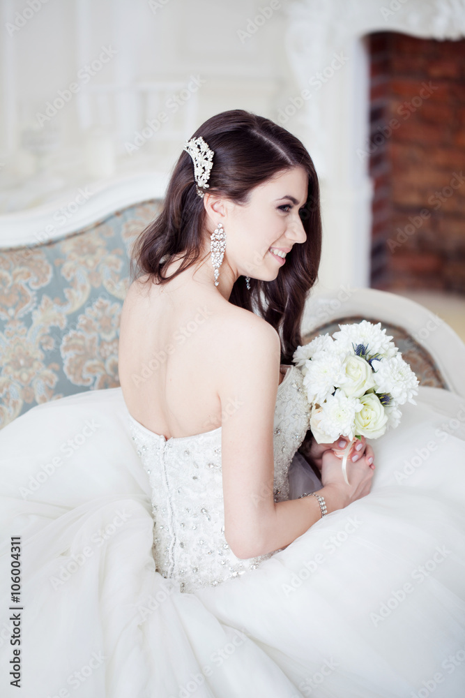 Portrait of beautiful bride. Dress with open back. Wedding decoration Portrait of beautiful bride. Dress with open back. Wedding decoration