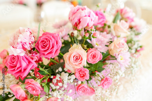 wedding bouquet with rose bush  Ranunculus asiaticus as a backgr