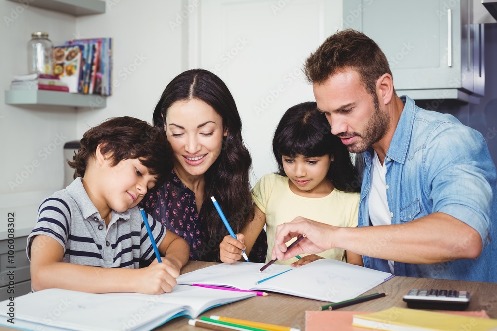 Parents assisting children doing homework 