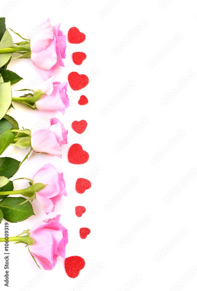 Red roses and heart shape ornaments on white background. Red roses and heart shape ornaments on white background.