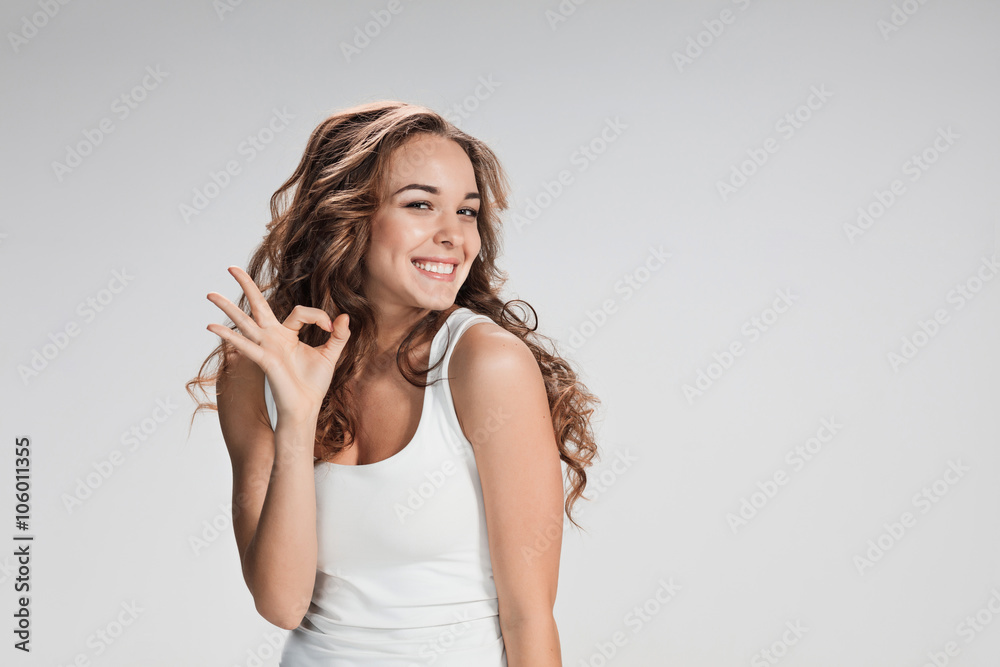 The young woman's portrait with happy emotions The young woman's portrait with happy emotions