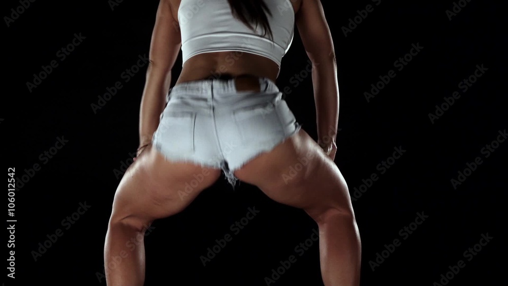 Girl in denim shorts dance twerk. Black. Slow motion Stock ビデオ | Adobe Stock