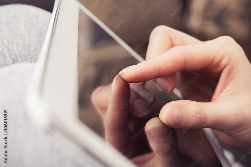 Female Hand Doing Zoom Gesture On Blank Display Of A Business Tablet