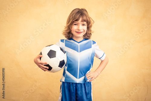 Child is pretending to be a soccer player