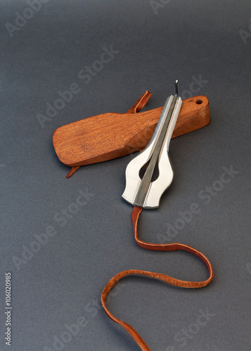 Jew's harp with wooden case on grey background photo