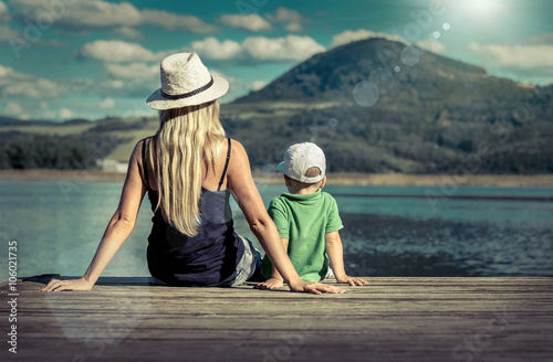 Happiness mother and son on the pier at sunny day under sunlight © Andrii IURLOV